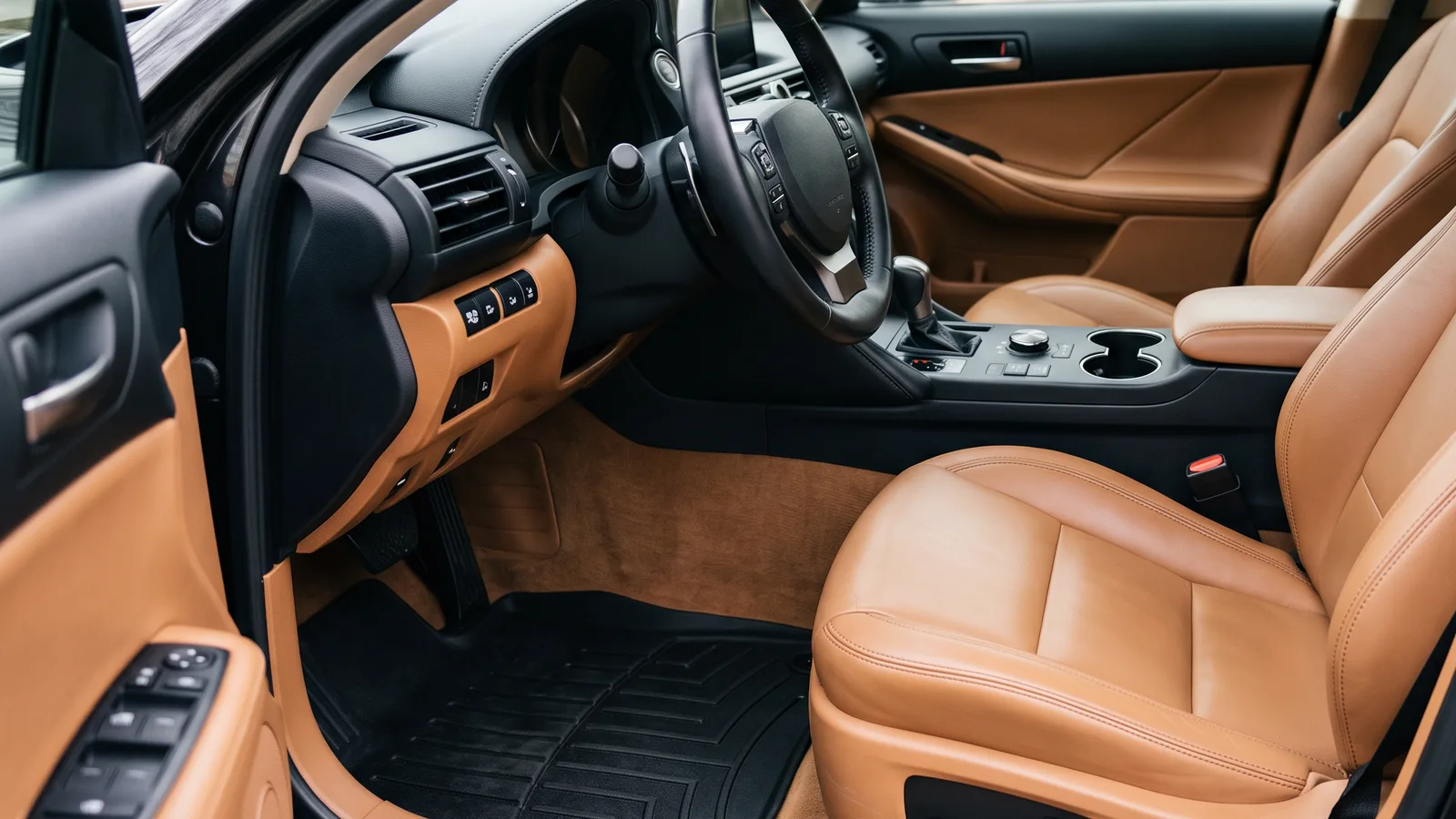 Detailed sedan interior with freshly cleaned and conditioned tan leather seats, clean carpet, spotless console and dashboard, prepped before selling the car