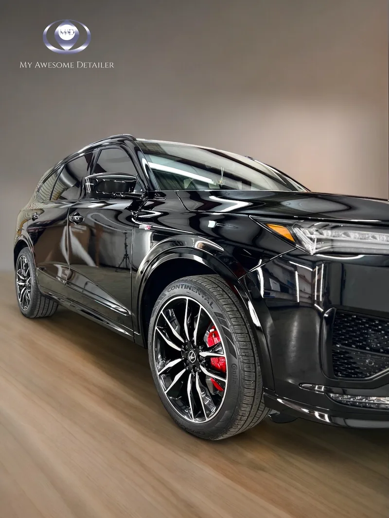 Black Cadillac SUV glossy finish