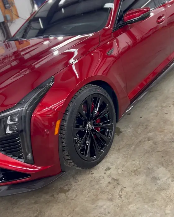 A candy red Cadillac CT5-V Blackwing in our shop after ceramic coating