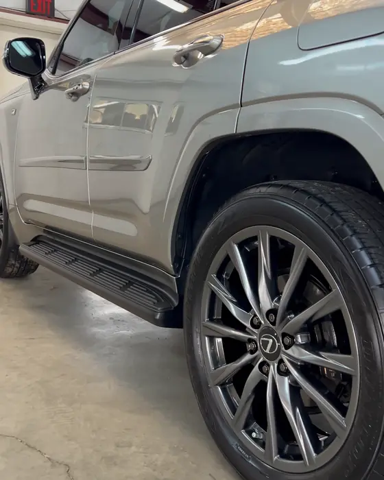 A champagne Lexus LX 600 side and wheel in our shop after ceramic coating
